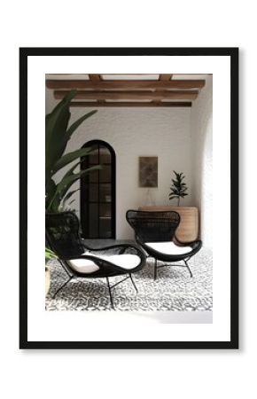 Black Wicker Chairs on Patio with White Cushions