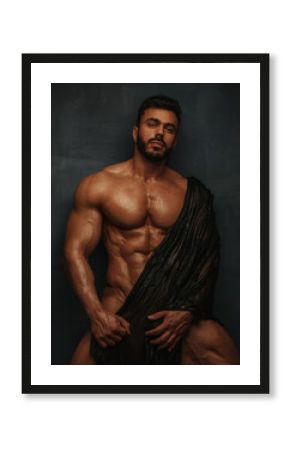 Naked bodybuilder with wet textile
