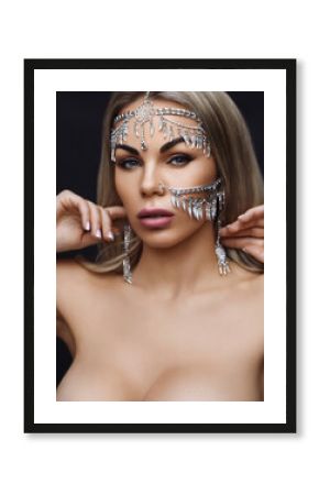 Fashionable nude and stylish woman in trendy jewelry. Close-up Portrait of a beautiful blonde girl. Jewelry accessories on the face of model. Beauty and style concept.  Fashion look. Natural makeup