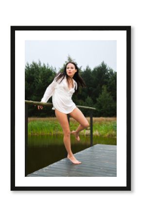 half-naked woman in a white shirt on nature background