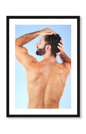 Water, shower and back of man in studio for skincare, wellness and shampoo cosmetics on blue background. Hair, body and male model cleaning with water, beauty and dermatology on bathroom backdrop