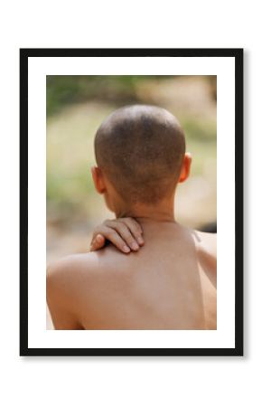 Anonymous naked women touching back in forest