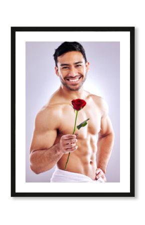 Man, rose and shirtless body in studio for natural scent, luxury fragrance or cosmetics. Spanish model, flower and beauty on white background with mockup space for organic aroma or designer cologne