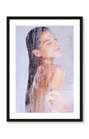 Shower, wash and woman with eyes closed in studio for hygiene, treatment or morning routine on white background. Body care, glass and female model with cloth for grooming, water drops or wellness