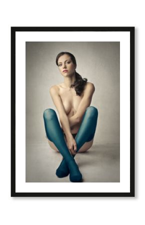 Naked girl wearing colored stockings