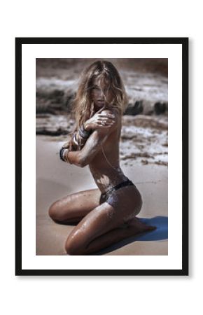 Sexy blonde lady on the beach.