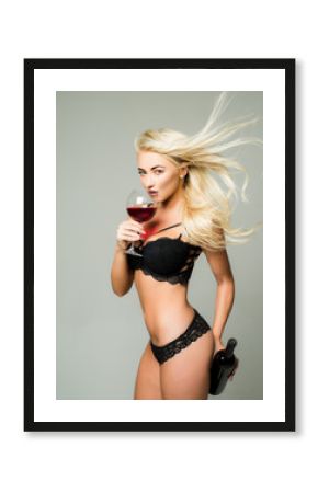 Blonde girl strippers and drink wine. Wine festival concept. Its for man. Gender roles. Private dance inside the club. Striptease is private dancing.