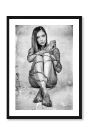 Naked woman chained in a steel chain
