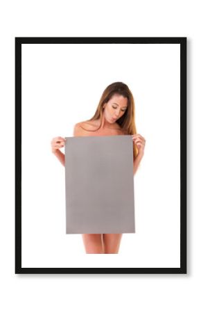 Ill gladly be your poster girl. Studio shot of a nude young woman covering herself with a blank field of tan copyspace.