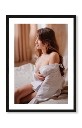 an attractive slender naked woman in a white shirt. prevention of breast cancer