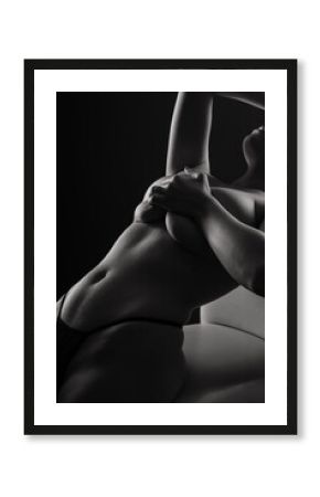 Topless sensual caucasian woman. On black background.