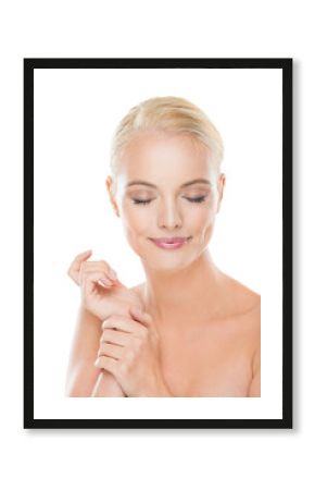 Portrait of a young woman with blonde hair and blue eyes looking at the camera with a white background
