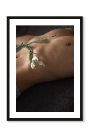 Naked Man Lies Relaxed With Delicate Flower