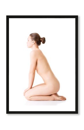 Attractive naked woman in a crouch.