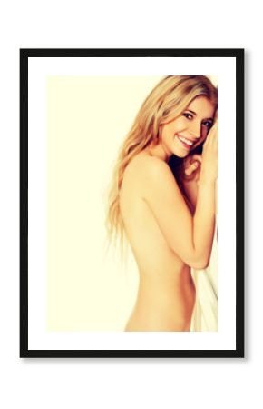 Topless woman against the door