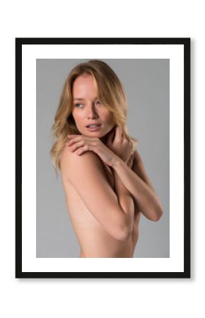 Nude blonde on gray