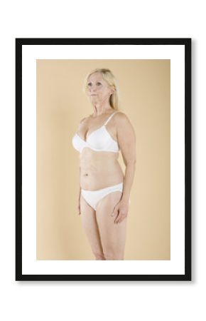 Middle aged woman in white lingerie