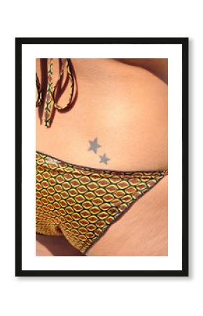Young woman with two tattooed stars
