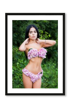 Spring girl. Sensual woman, flower bra, panties. Naked woman. Female with flowers. Girl with flowers instead of underwear, flowering. Bra and panties. Perfect female body with flowers, sexy underwear.