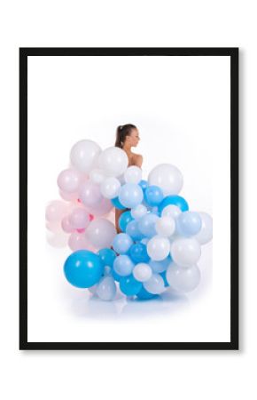 Nude girl with balloons posing on a white background.