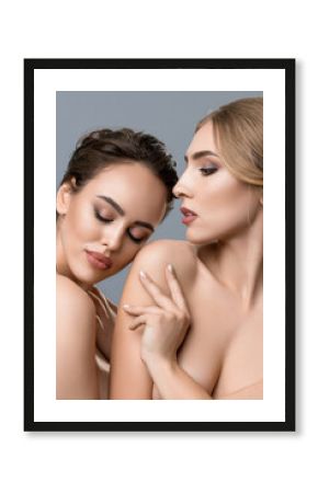 Naked women touching each other