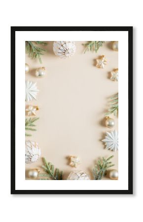 Vertical Christmas banner design. Boho style Christmas balls, stars decoration and fir branches on beige background. Flat lay, top view, copy space