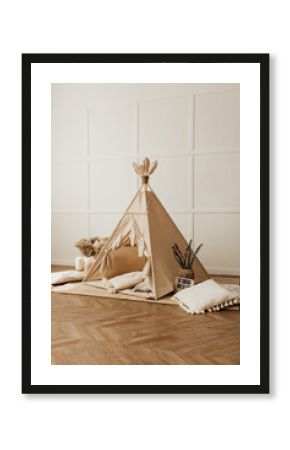 beige children's wigwam in the room on the floor Scandinavian style with decor