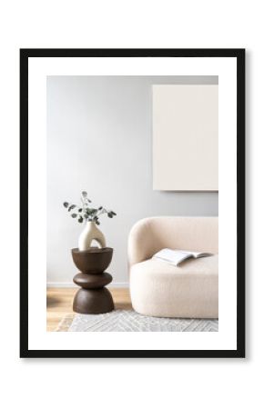 Abstract art, modern white sofa with end table and greenery in room