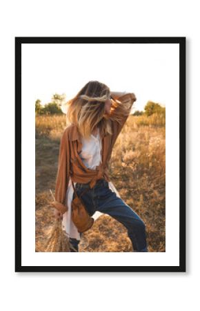 Beautiful blonde woman in the field
