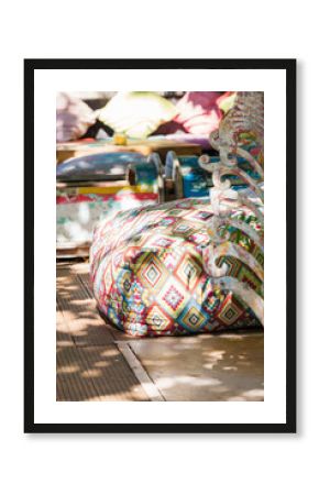 Boho style colorful poufs in garden outdoor decor