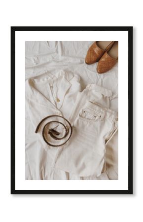 Fashion concept with female clothes and accessories on white linen. Flat lay, top view lifestyle fashion minimalist blogger composition.