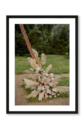 wedding ceremony arch and chairs in rustic boho style