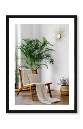 Bright living room with plaid on rattan chair