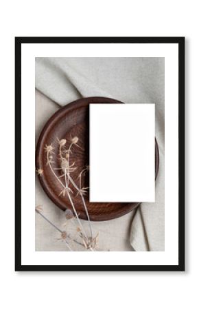 Aesthetic neutral business brand template or boho wedding invitation design, blank paper card mockup with copy space on brown ceramic plate and beige linen cloth with dried meadow flowers