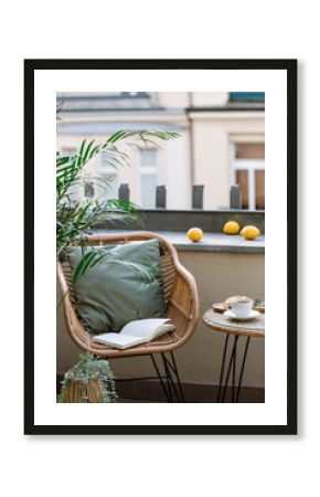 Vertical shot of rattan armchair next to coffee table on terrace of cafe