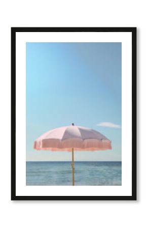 Retro pretty pink beach fringe umbrella parasol sand beach with windy sea waves cloud sky earthy natural color vacation relaxation seaside coast resort ocean vibes eco summer holiday tropical campaign