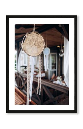 Handmade knitting dream catcher as a original wedding decoration in boho style