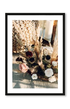 Wedding decor from dried flowers in boho style. Wedding in European style fine art at sunset.