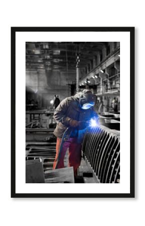 A welder at work in a shipyard.