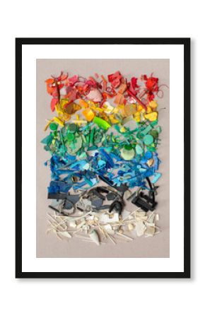 Pieces of colourful plastic on grey background