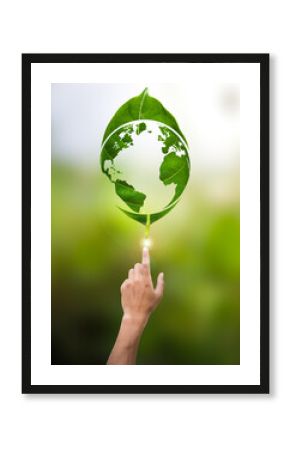 human hand pointing world map in green leaf environmental concept on earth day