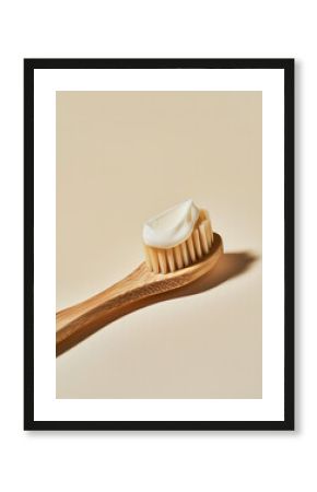 Wooden eco-friendly toothbrush with toothpaste on beige background