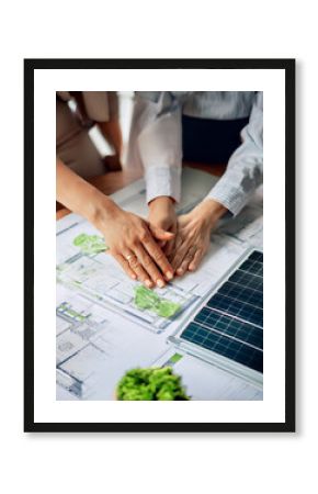 Eco business company meeting with group of business people using laptop to plan strategy and discuss marketing of eco-friendly and clean energy products. Green business company concept. Trailblazing