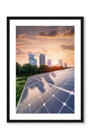 Ecological energy renewable solar panel plant with urban landscape landmarks in sunset