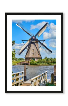 Netherlands rural lanscape with windmills at famous tourist site Kinderdijk in Holland. Old Dutch village Kinderdijk, UNESCO world heritage site. 
