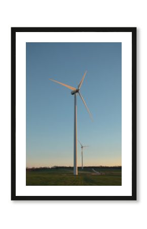 Windmill on the green field