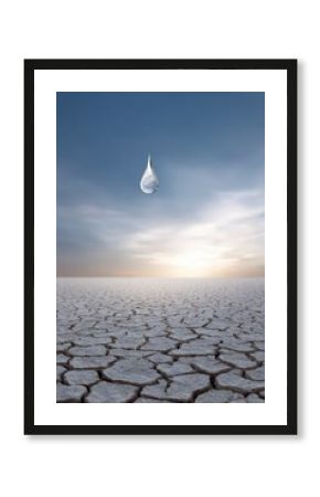 Droplet Falling on Dry Cracked Land Under a Blue Sky