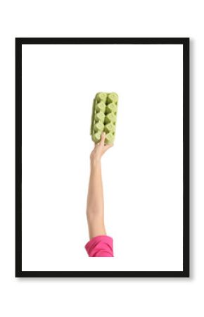 Woman holding egg carton isolated on white, closeup. Waste recycling concept