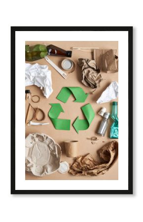 Various recycled materials creatively repurposed into art or useful objects illustrate the concept of waste reduction and reuse.