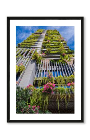 facade of a modern green ecology residential building of a skyscraper with landscaping and hanging gardens